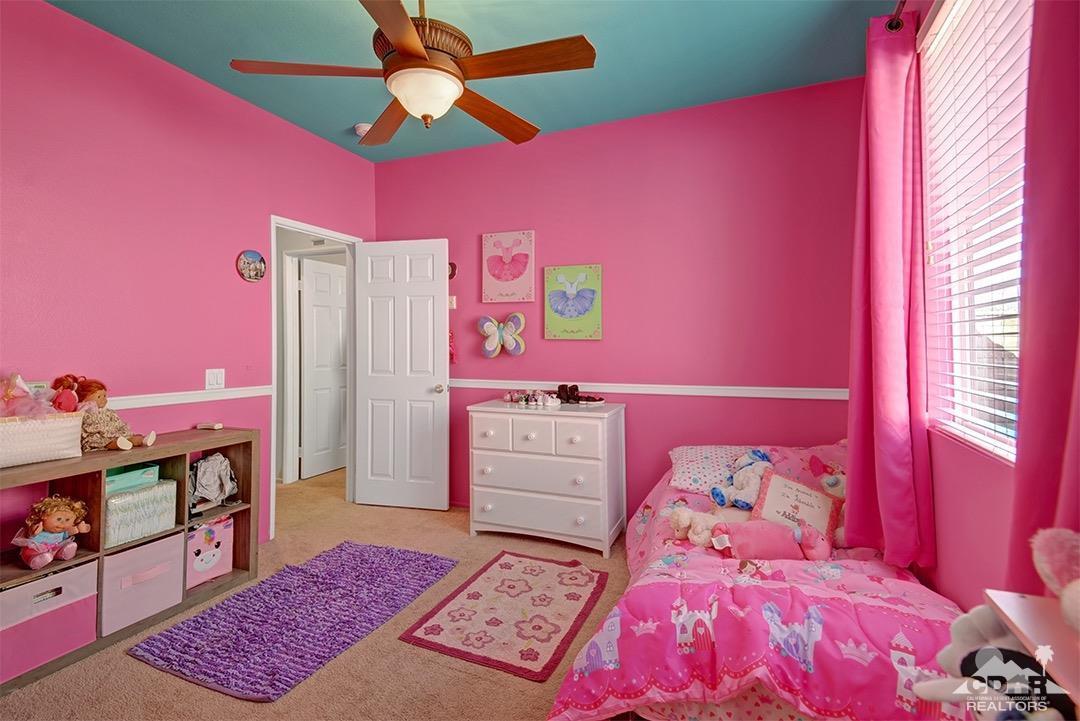 37388 Haweswater Road Indio, CA 92203 - Photo 23 of 28 a bed room with a bed and a dresser