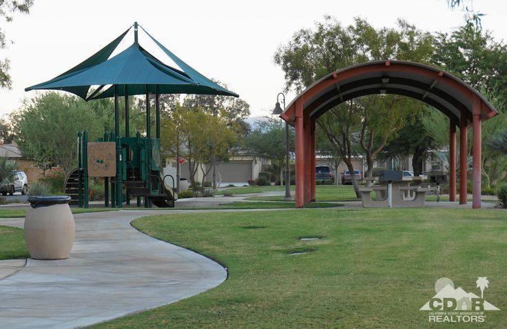 37388 Haweswater Road Indio, CA 92203 - Photo 28 of 28 a view of a garden with a slide and large trees