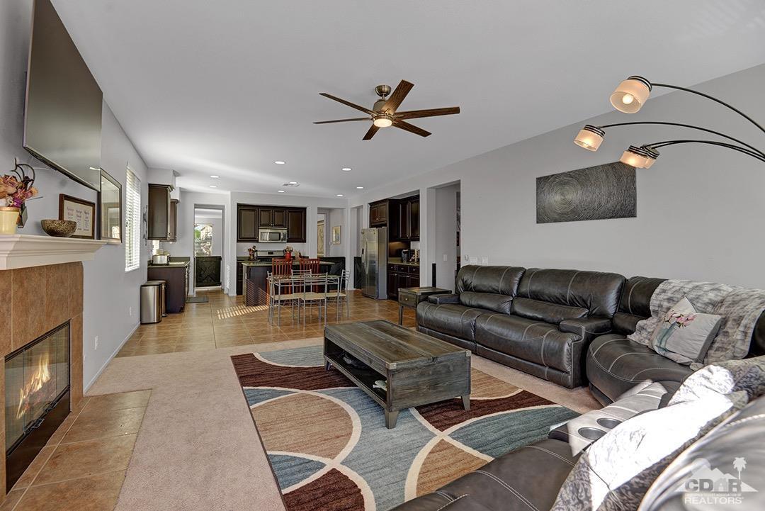 37388 Haweswater Road Indio, CA 92203 - Photo 5 of 28 a living room with furniture and a flat screen tv