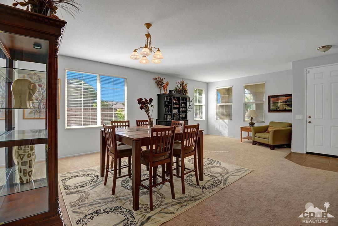 37388 Haweswater Road Indio, CA 92203 - Photo 9 of 28 a view of a dining room with furniture and a chandelier
