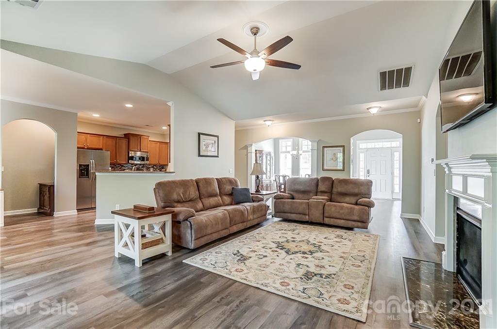 827 Solandra Way Fort Mill, SC 29708 - Photo 12 of 43 a living room with furniture and a fireplace