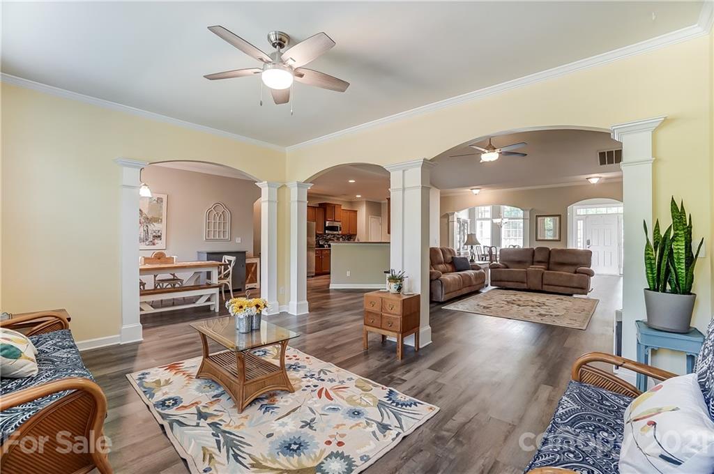 827 Solandra Way Fort Mill, SC 29708 - Photo 16 of 43 a living room with furniture and wooden floor