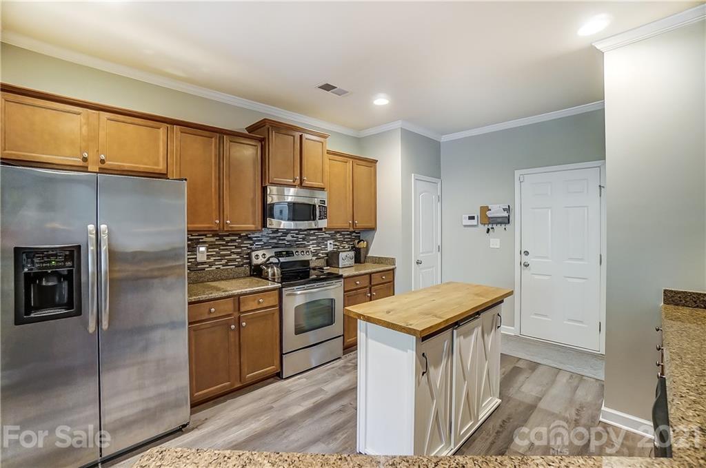 827 Solandra Way Fort Mill, SC 29708 - Photo 19 of 43 a kitchen with a refrigerator sink and stove