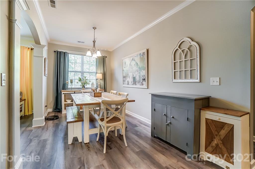 827 Solandra Way Fort Mill, SC 29708 - Photo 23 of 43 a view of a a dining room with furniture window and wooden floor