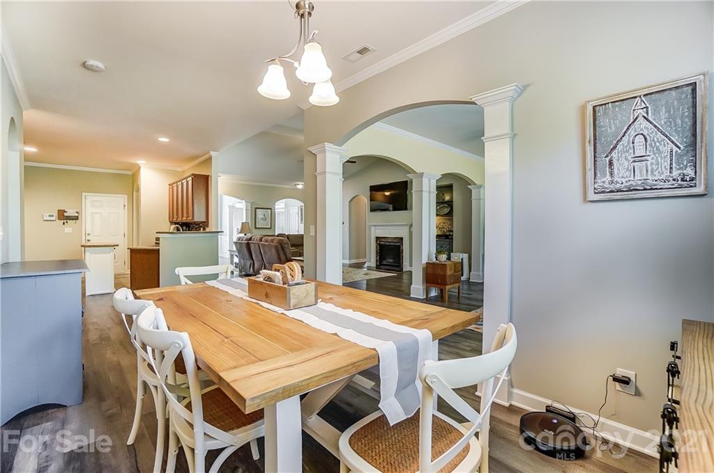 827 Solandra Way Fort Mill, SC 29708 - Photo 26 of 43 a view of a dining room with furniture and a chandelier