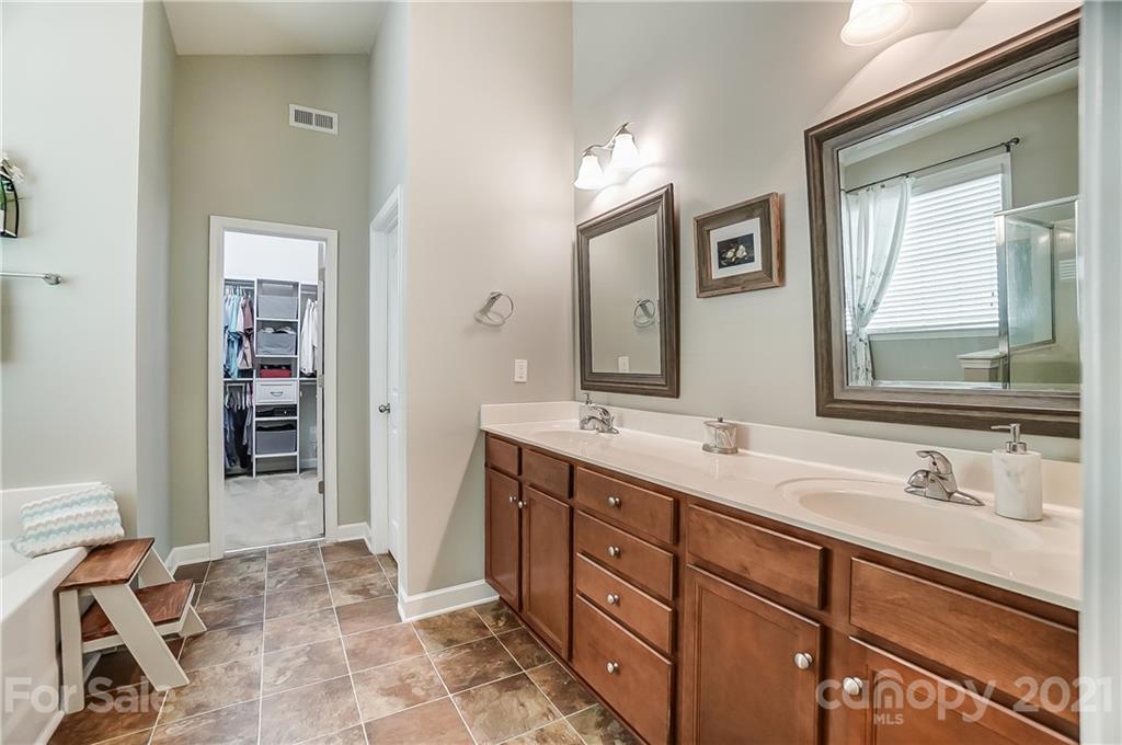 827 Solandra Way Fort Mill, SC 29708 - Photo 29 of 43 a bathroom with a sink double vanity and a mirror