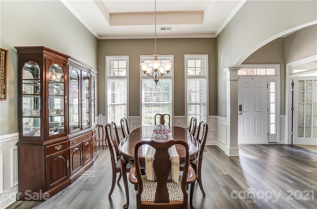 827 Solandra Way Fort Mill, SC 29708 - Photo 4 of 43 a view of a dining room with furniture window and wooden floor