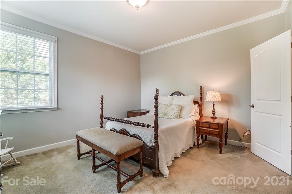 827 Solandra Way Fort Mill, SC 29708 - Photo 31 of 43 a room with a bed and a table in it