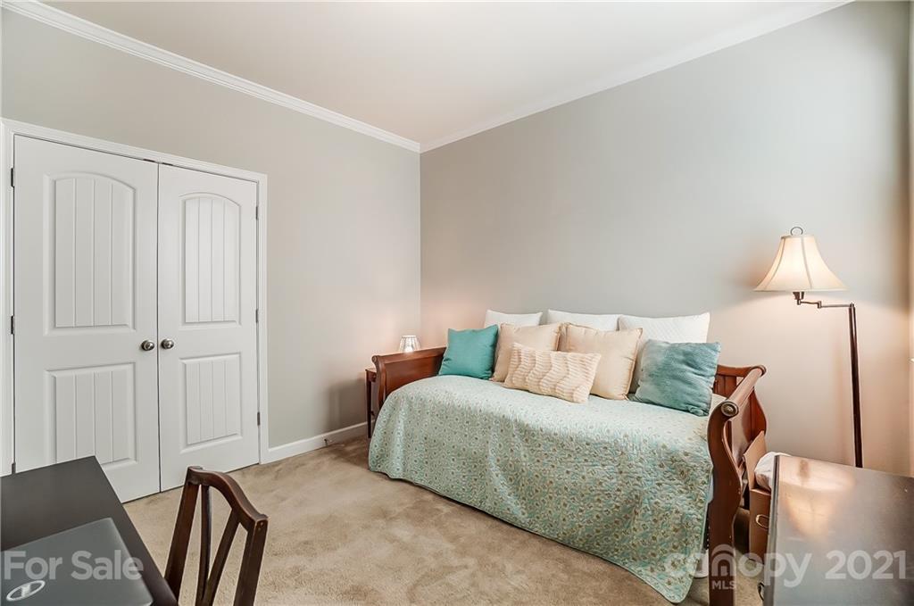 827 Solandra Way Fort Mill, SC 29708 - Photo 35 of 43 a bedroom with a bed and a lamp