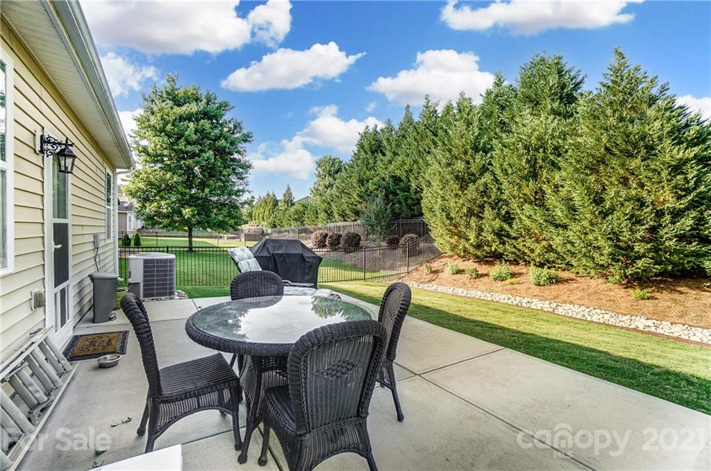 827 Solandra Way Fort Mill, SC 29708 - Photo 40 of 43 a view of a dining table and chairs in the patio