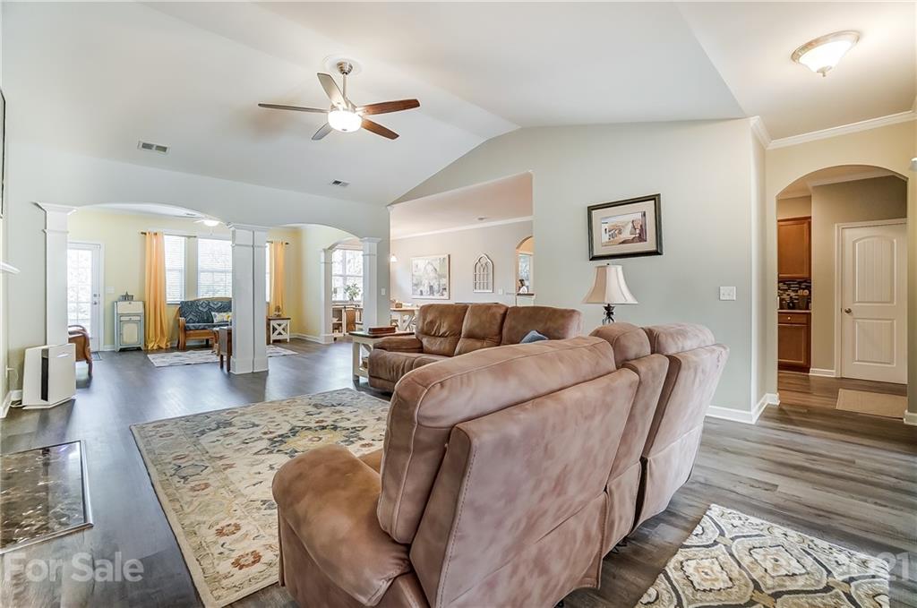 827 Solandra Way Fort Mill, SC 29708 - Photo 9 of 43 a living room with furniture and a chandelier