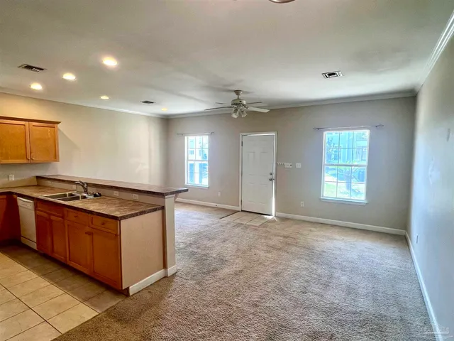a kitchen with stainless steel appliances granite countertop a stove and a sink