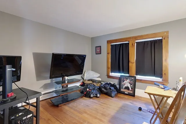 a view of a livingroom with workspace and a couch
