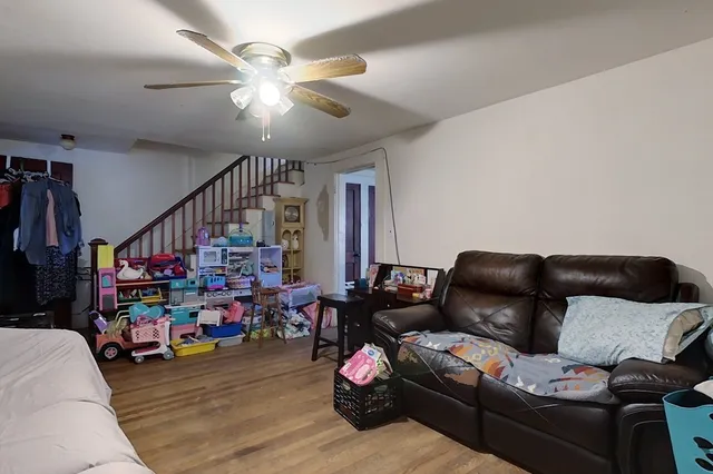 a living room with lots of furniture and a chandelier