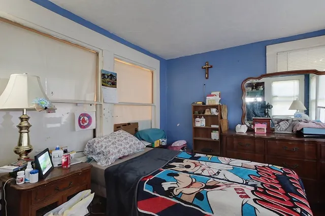 a bed room with a bed and furniture