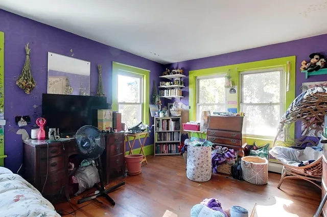 a room with furniture toys and a fireplace