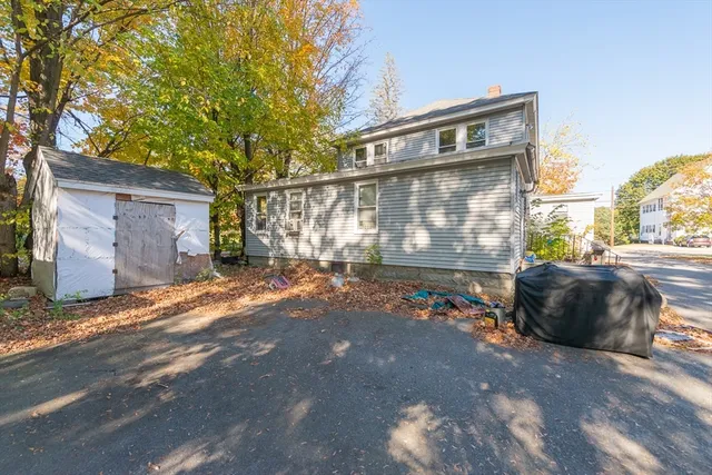 a view of a street with a building in the background