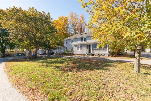 a house view with swimming pool in front of it
