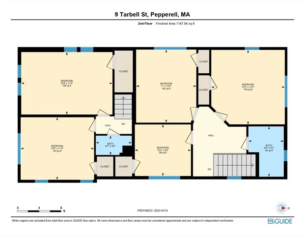 a picture of a building with a couple of cars parked on the road