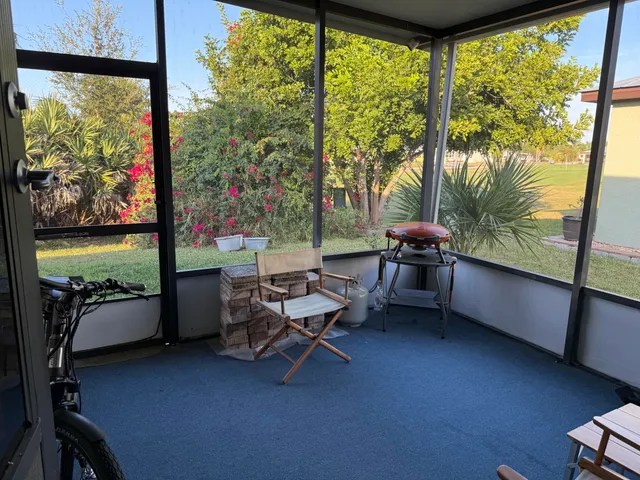 a reading room with furniture and a window