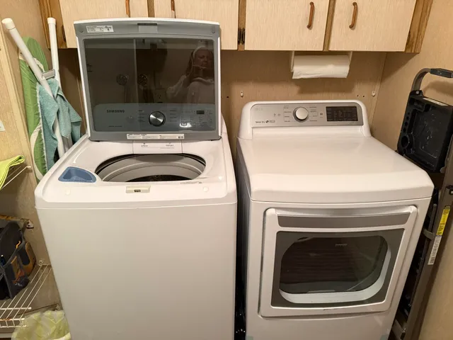 a utility room with dryer and washer