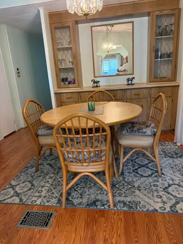 a view of a chairs and table in the patio