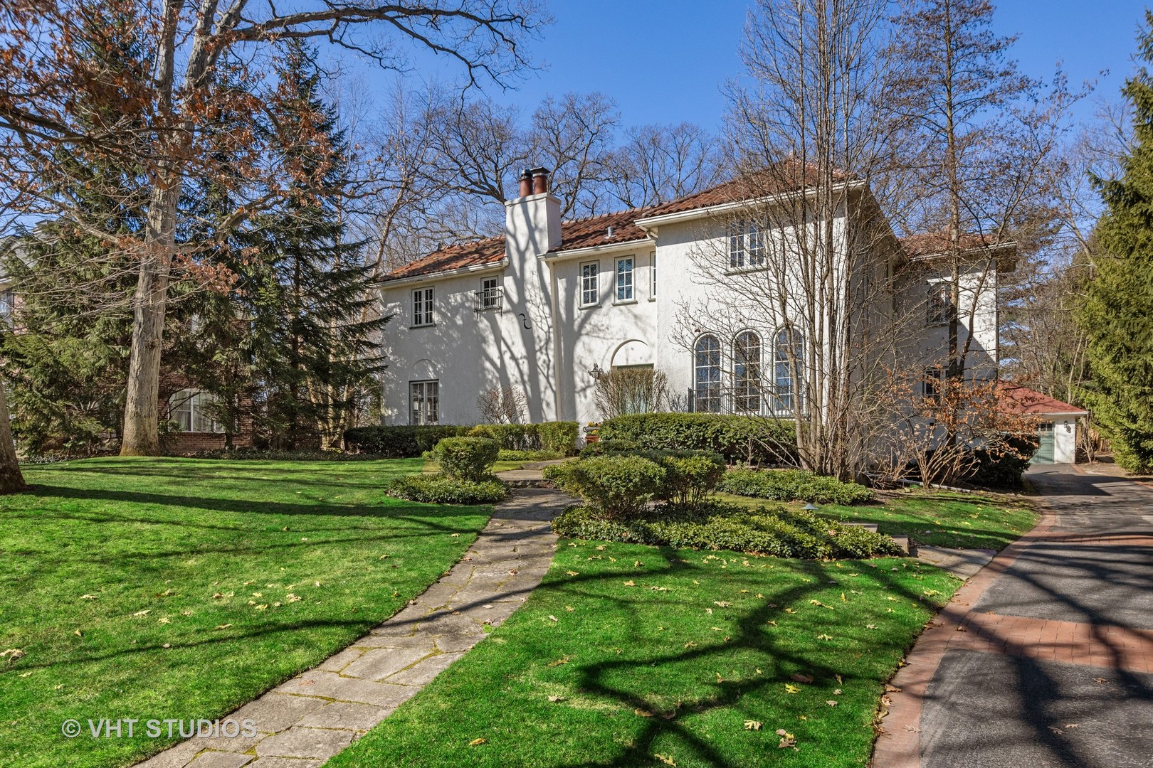 128 Church Road Winnetka, IL 60093 - Photo 2 of 46 a view of a house with a yard