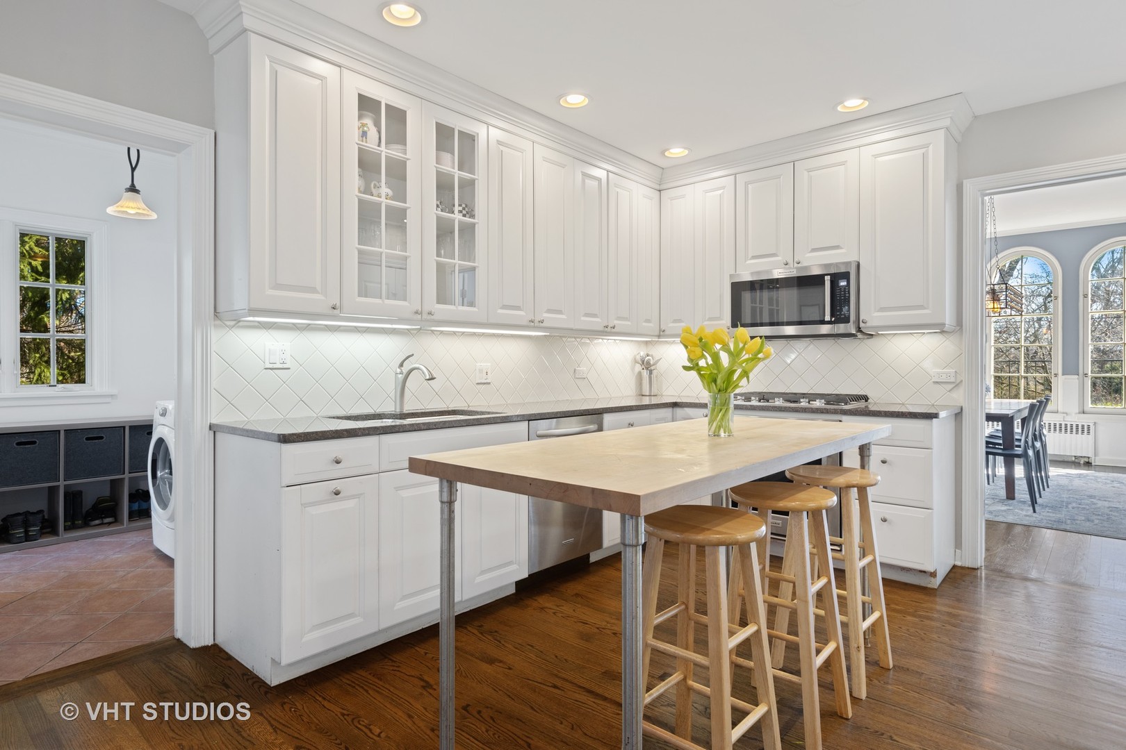 128 Church Road Winnetka, IL 60093 - Photo 20 of 46 a kitchen with stainless steel appliances granite countertop a sink and cabinets