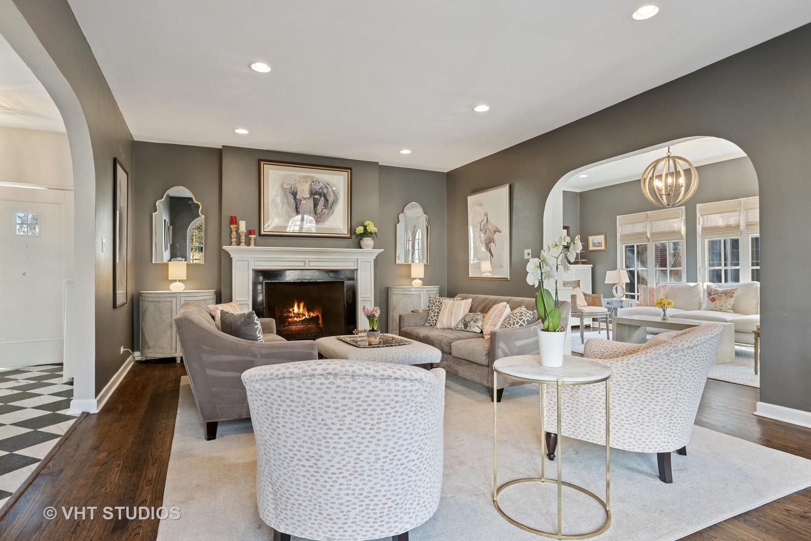 128 Church Road Winnetka, IL 60093 - Photo 4 of 46 a living room with furniture a large window and a fireplace