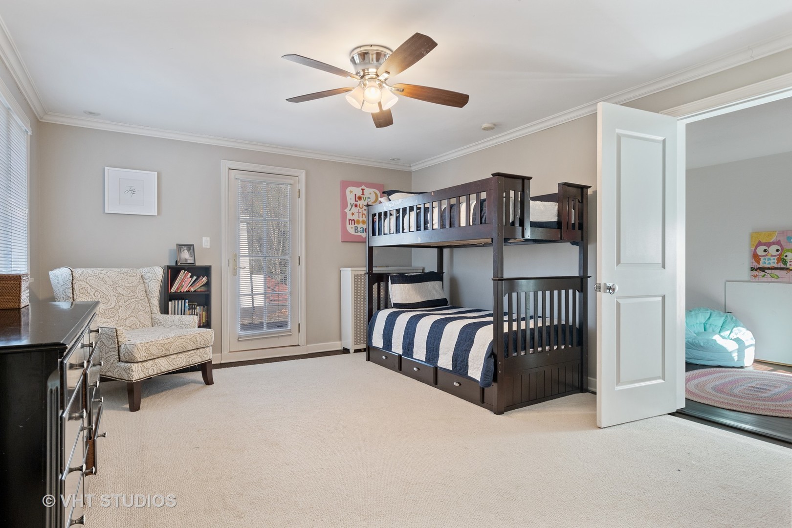 128 Church Road Winnetka, IL 60093 - Photo 31 of 46 a bedroom with furniture and a chandelier