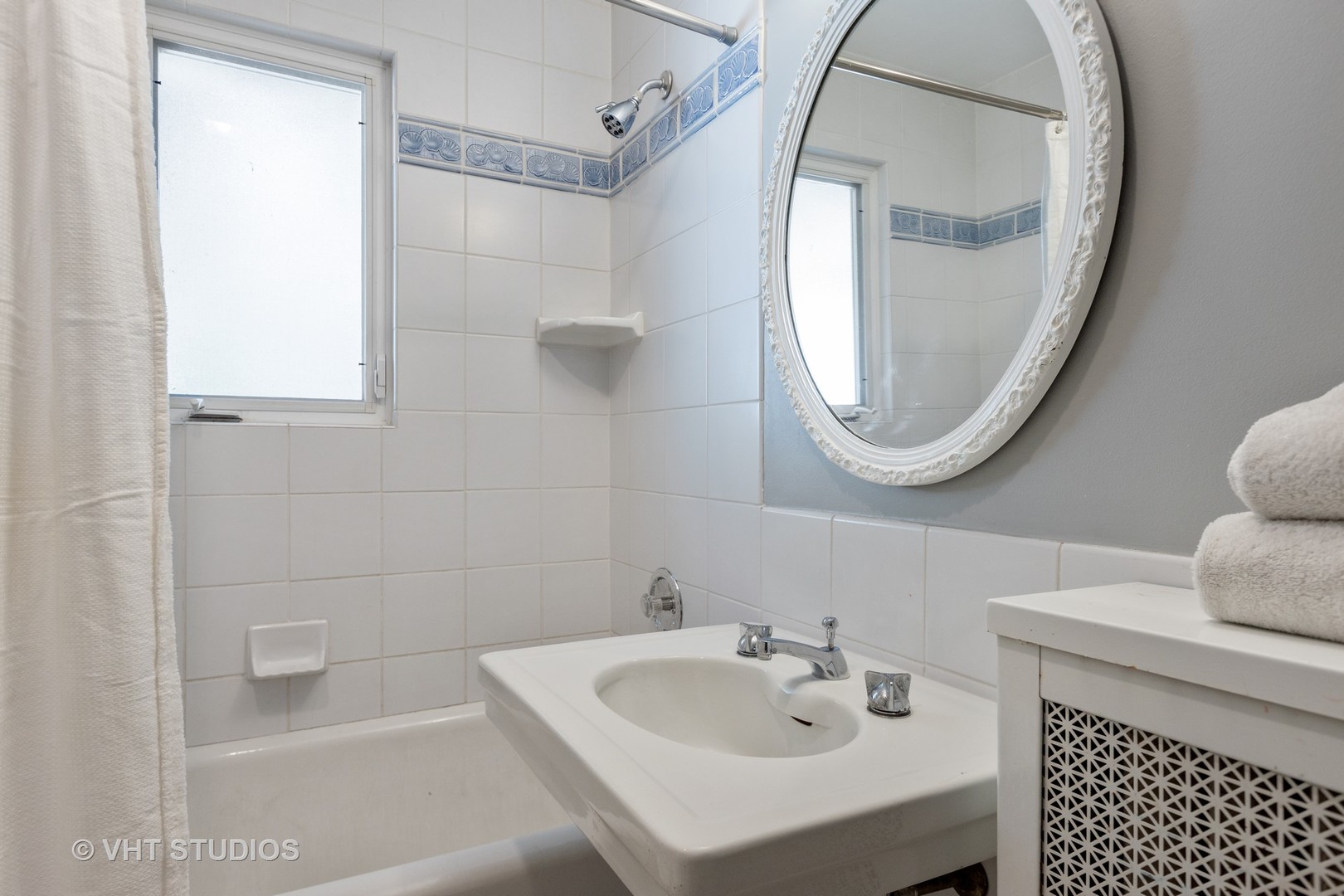 128 Church Road Winnetka, IL 60093 - Photo 33 of 46 a bathroom with a sink a mirror and a shower