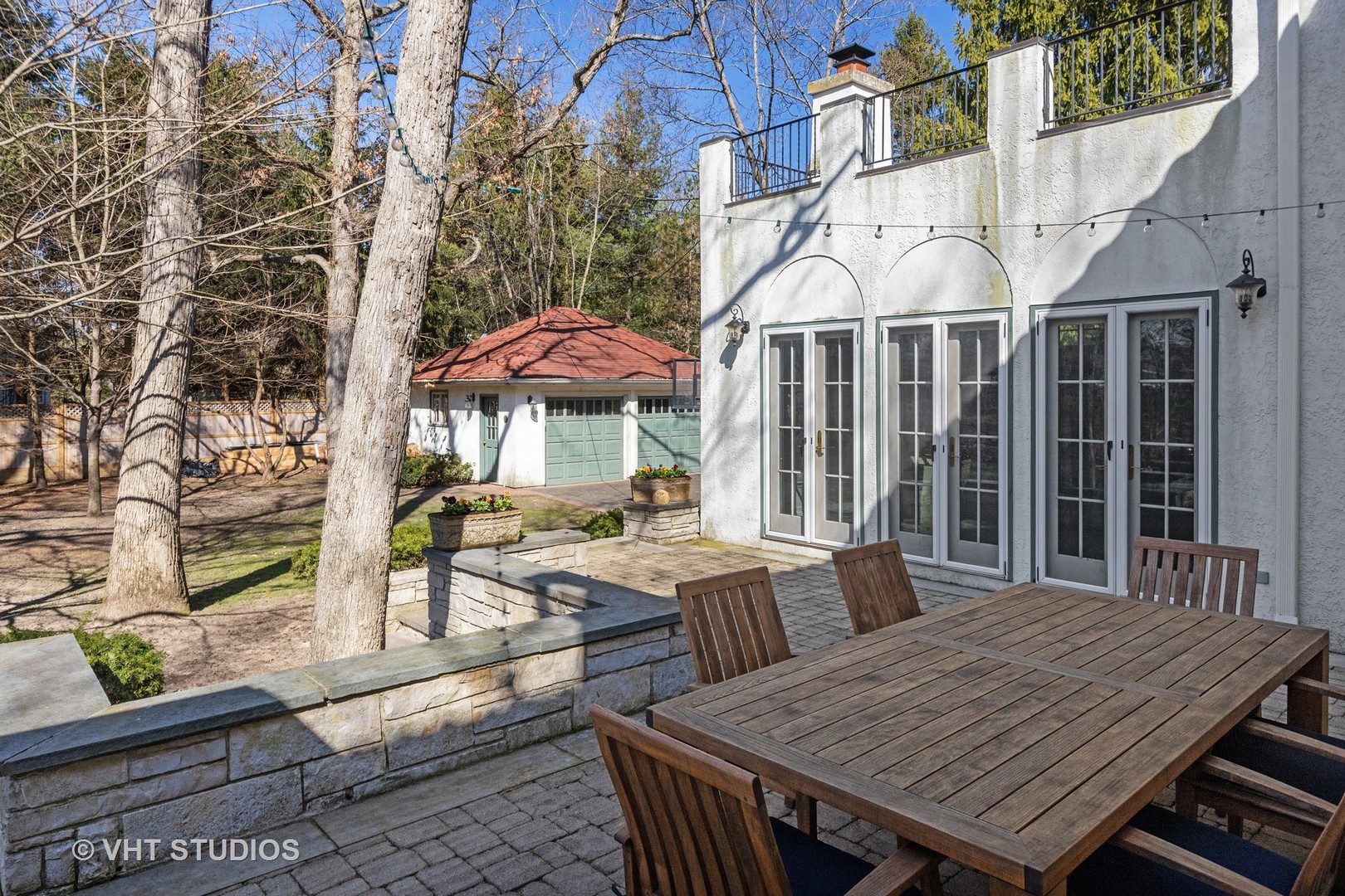 128 Church Road Winnetka, IL 60093 - Photo 37 of 46 an outdoor space with furniture and umbrella