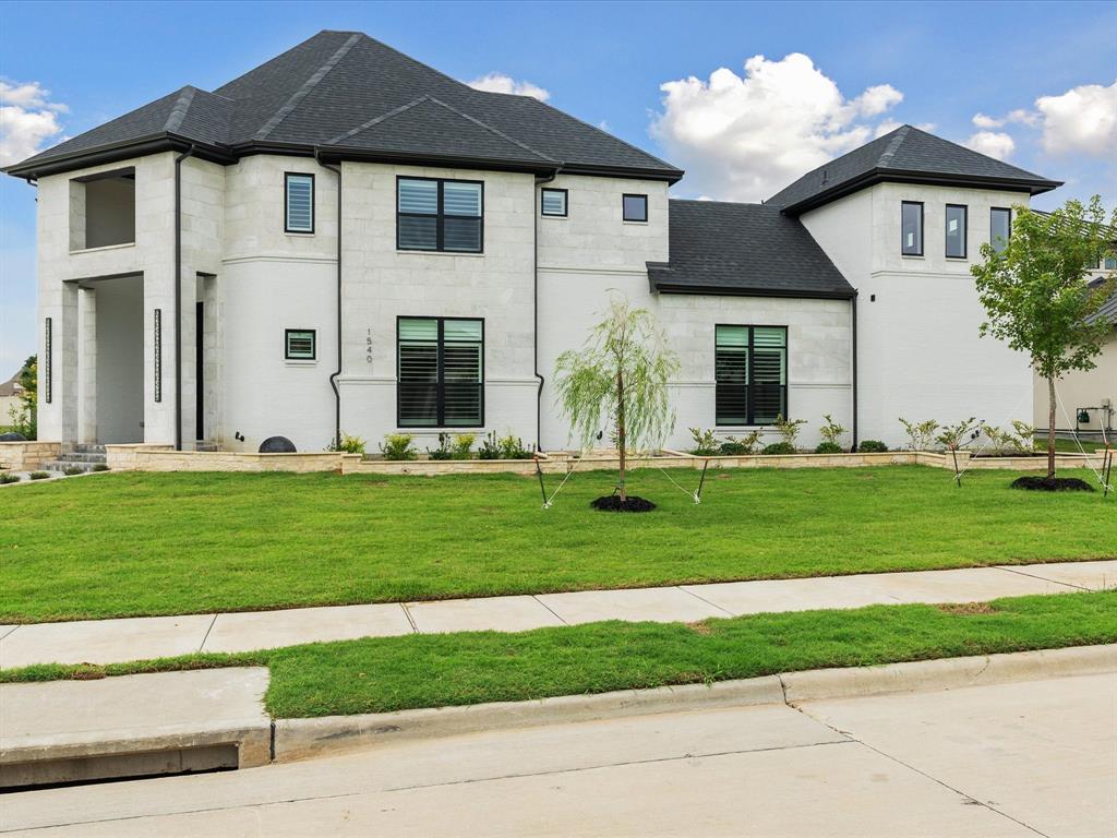 1540 St Peter Lane Prosper, TX 75078 - Photo 2 of 7 a front view of a house with a yard