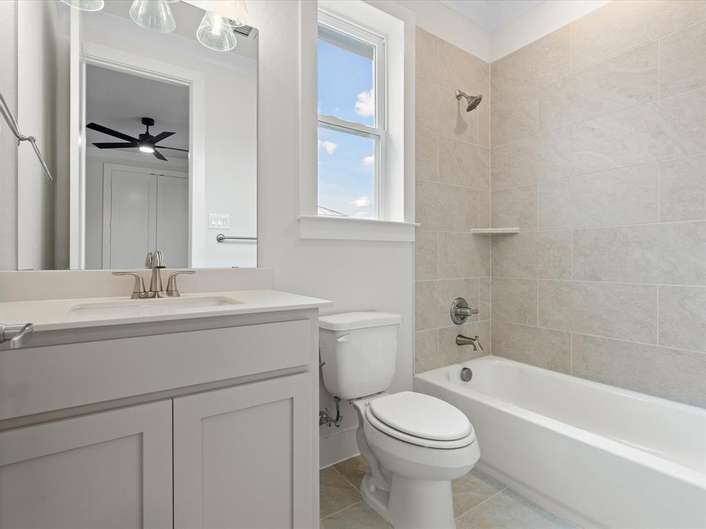 1540 St Peter Lane Prosper, TX 75078 - Photo 6 of 7 a bathroom with a sink toilet and bathtub