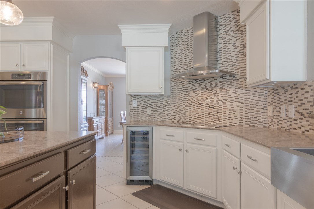 550 Hays Country Acres Road Dripping Springs, TX 78620 - Photo 13 of 40 a bathroom with a granite countertop sink a vanity and a mirror