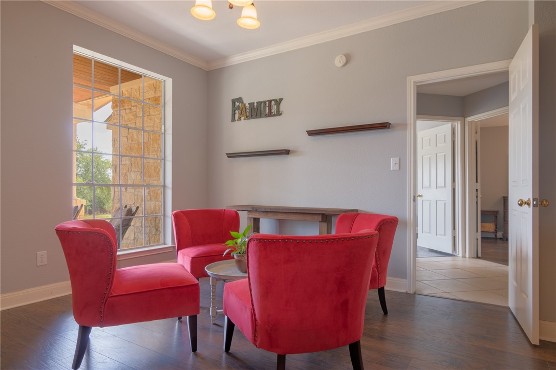 550 Hays Country Acres Road Dripping Springs, TX 78620 - Photo 17 of 40 a view of a dining room with furniture and wooden floor