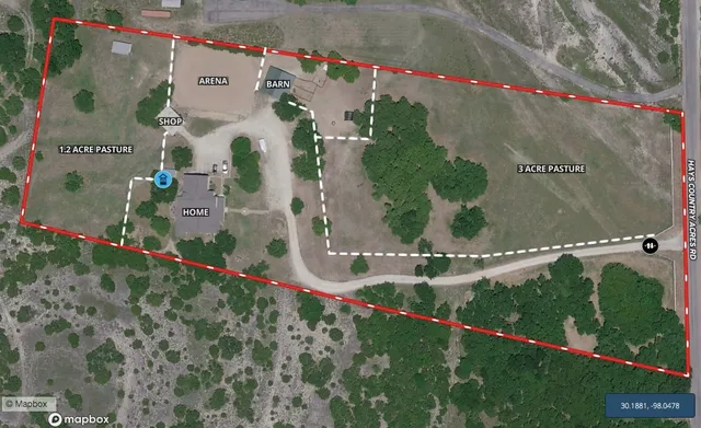 an aerial view of residential houses and outdoor space