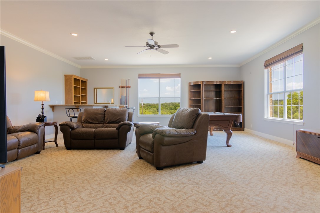 550 Hays Country Acres Road Dripping Springs, TX 78620 - Photo 24 of 40 a living room with furniture and a large window