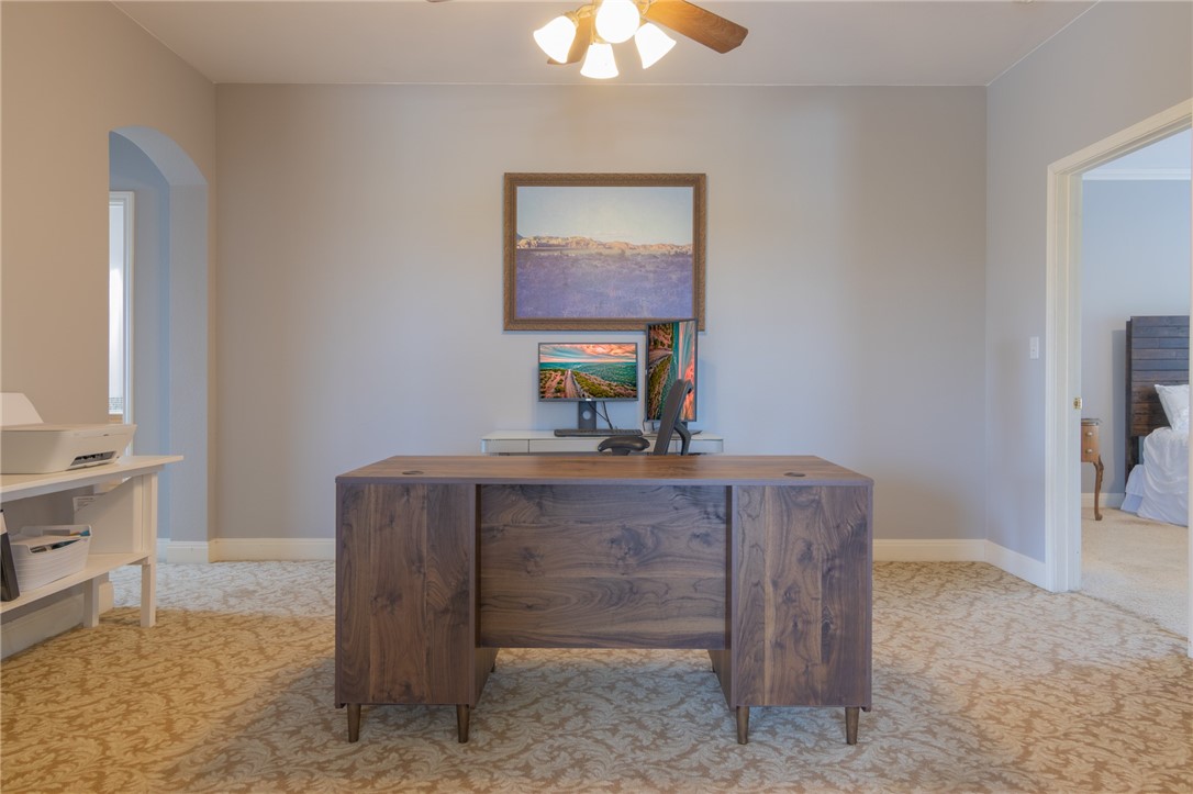 550 Hays Country Acres Road Dripping Springs, TX 78620 - Photo 25 of 40 a room with a table chairs and a chandelier