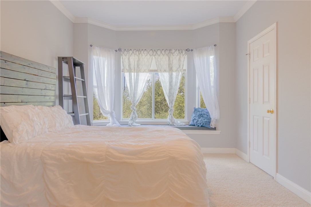 550 Hays Country Acres Road Dripping Springs, TX 78620 - Photo 26 of 40 a bedroom with a bed and a window