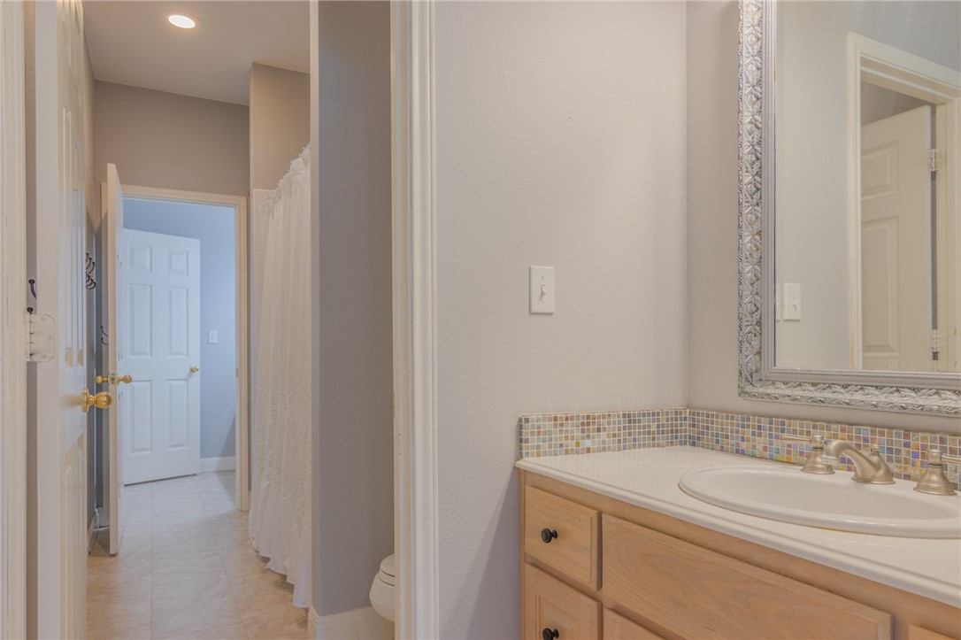550 Hays Country Acres Road Dripping Springs, TX 78620 - Photo 28 of 40 a bathroom with a sink and vanity