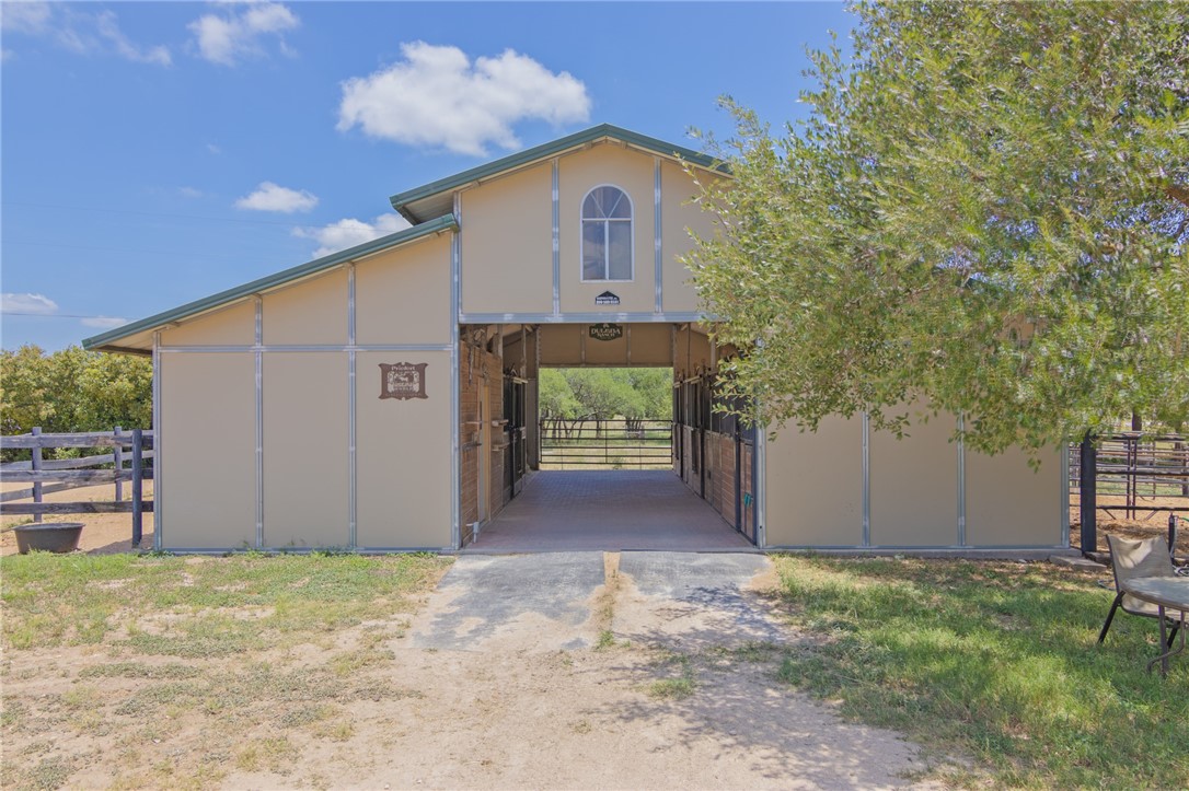 550 Hays Country Acres Road Dripping Springs, TX 78620 - Photo 3 of 40 a front view of a house with a yard and garage