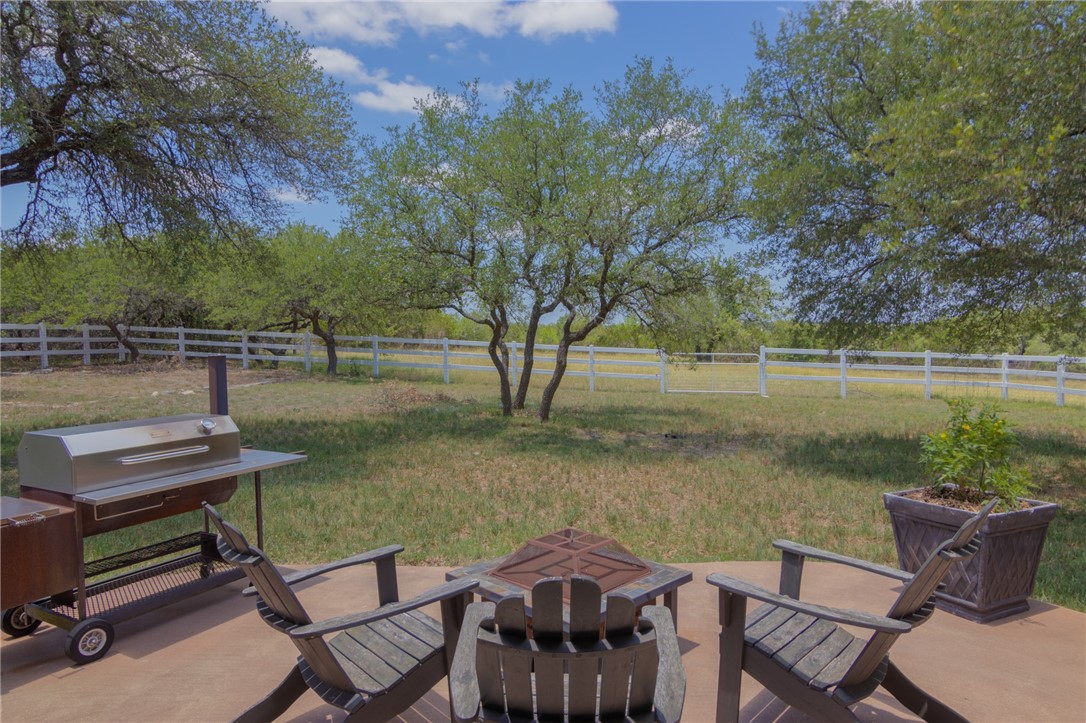 550 Hays Country Acres Road Dripping Springs, TX 78620 - Photo 33 of 40 a view of a lake with table and chairs