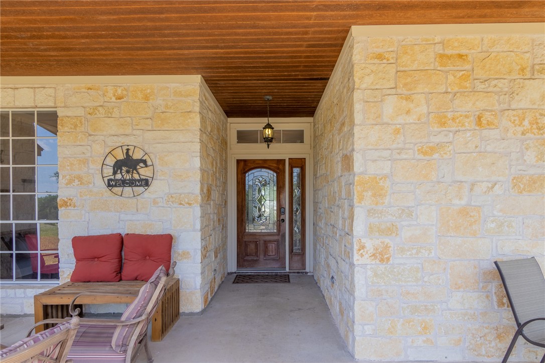 550 Hays Country Acres Road Dripping Springs, TX 78620 - Photo 7 of 40 a front view of a house with outdoor seating