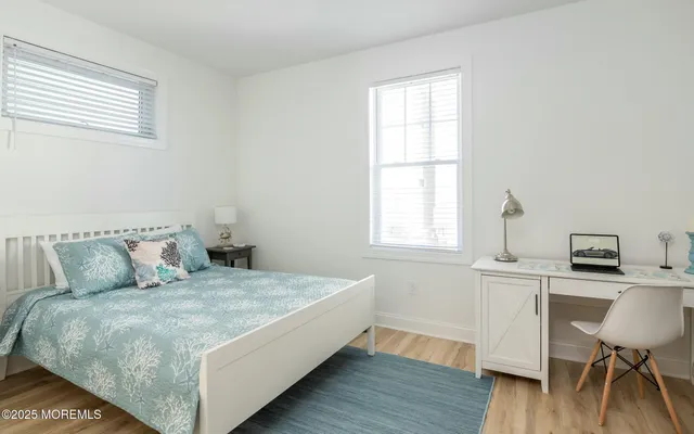 a bedroom with a bed and a table in it