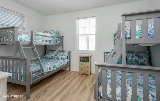 a view of a deck front of house with wooden floor