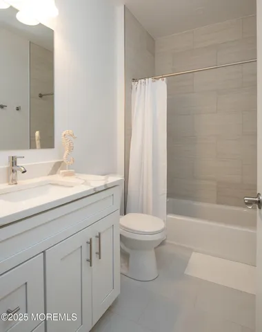 a bathroom with a sink a toilet and a bathtub