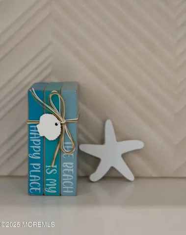 a view of a room with a table and chairs in wooden floor
