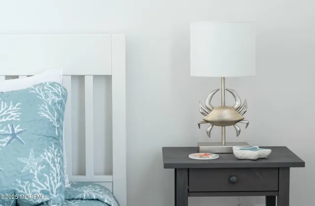 a bedroom with a bed and a night stand