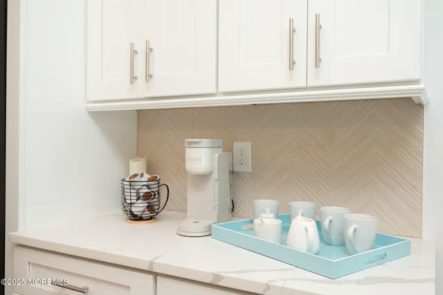 a kitchen with a sink and a stove top oven